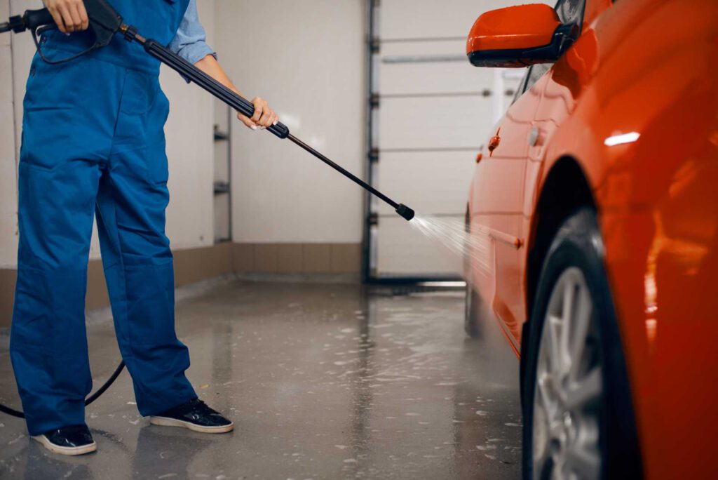 toward sustainability, garage technician washing car