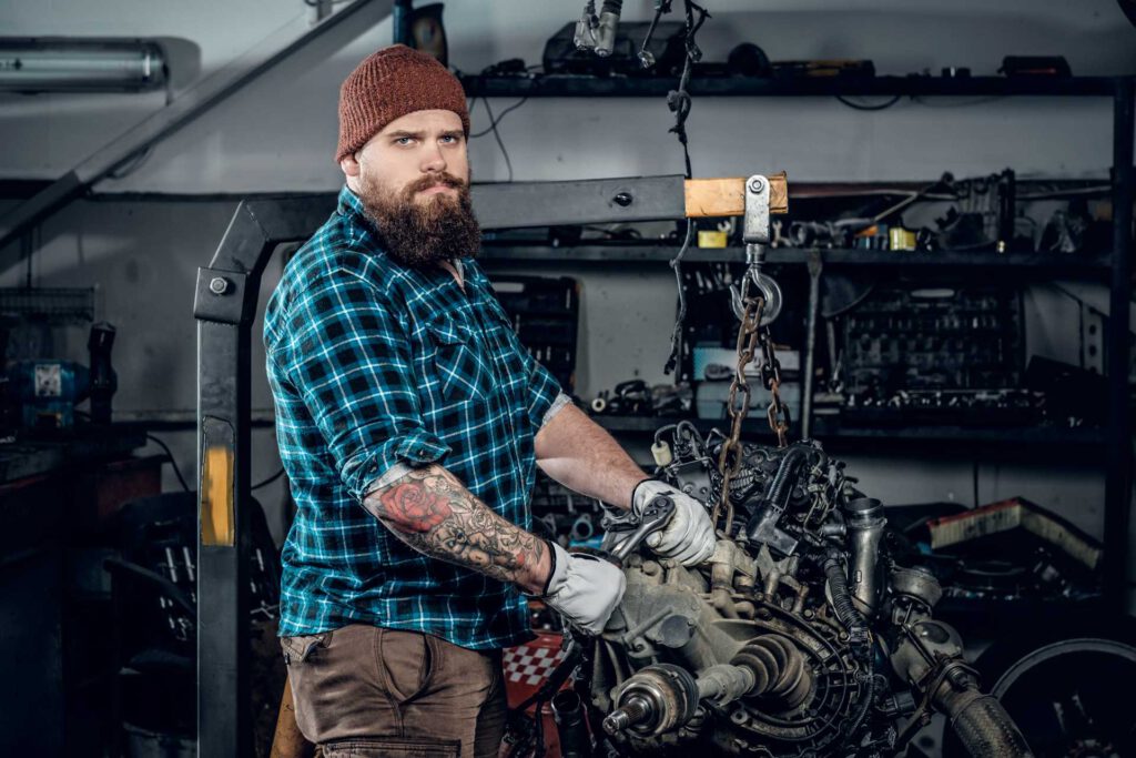 garage for services, mechanic working on internal part of car