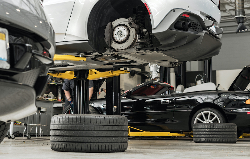 Essential garage tools, car elevated on a vehicle lift