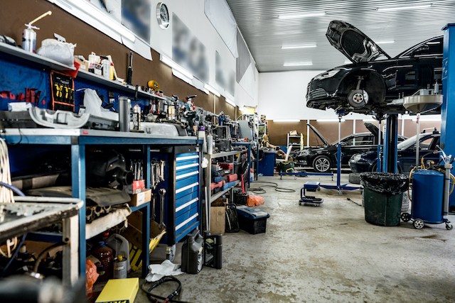 Garage upgrade, car garage with many tools and a vehicle lift